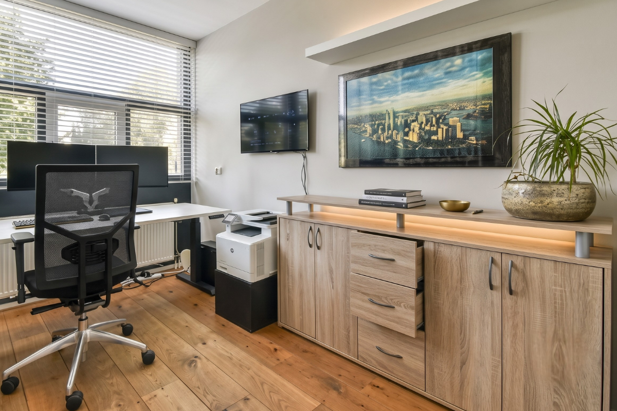 Custom home office with desk, bookcases and closed storage